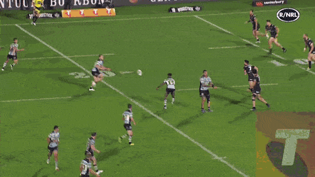 A rugby game where the offense is passing the ball backwards.