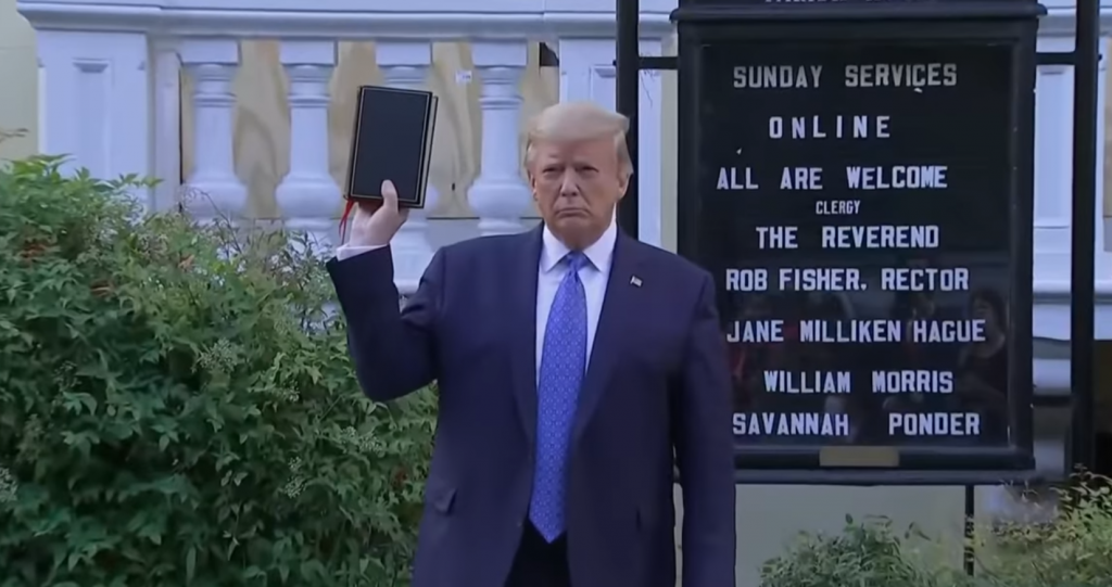 Donald Trump holding a bible in front of a boarded-up church