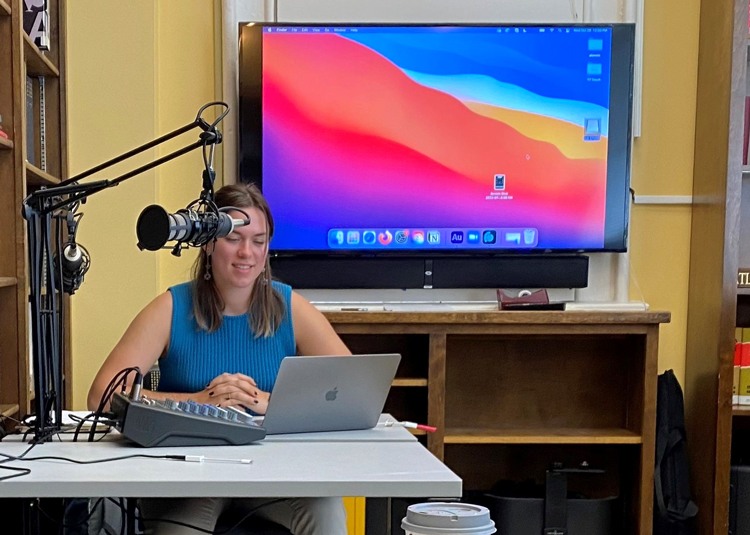 graduate student hosting a podcast workshop in the digital lab